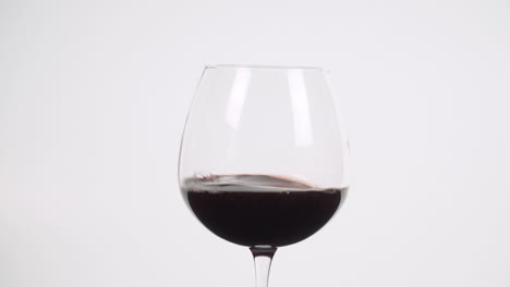 Red-wine-swirled-in-burgundy-glass-slow-motion-100-fps