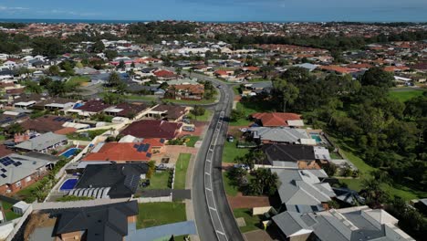 perth coastal suburn cityscape skyline - aerial rising revealing urban suburban neighborhood with private houses, western australia - copy space