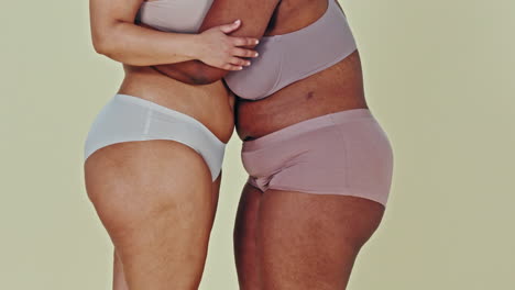 two women embracing body positivity