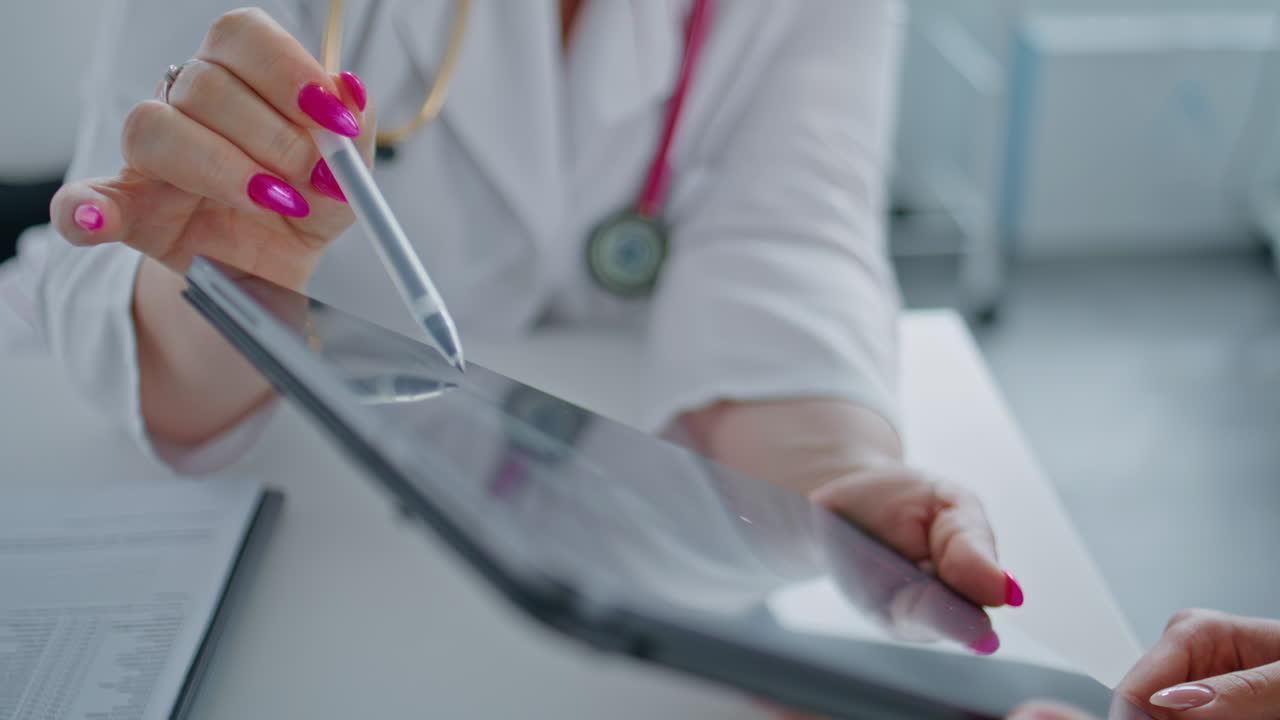 Medical consultation with a doctor and patient using a tablet