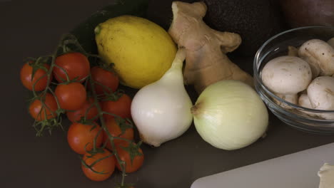 fresh and organic vegetables and fruits on the table with block of tofu. - close up shot