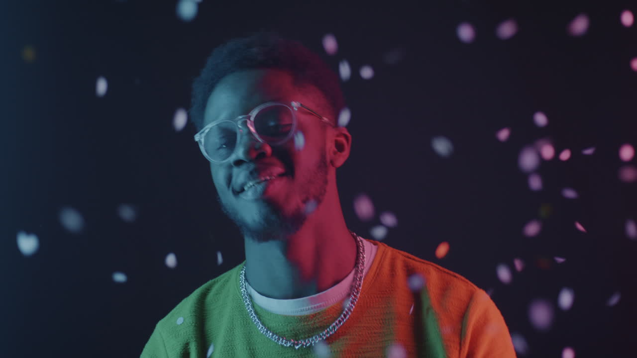 Happy Man in Neon Lights with Confetti