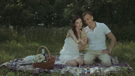 cheerful couple taking selfie after engagement proposal