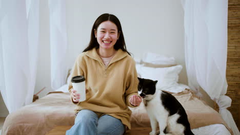 woman feeding cat