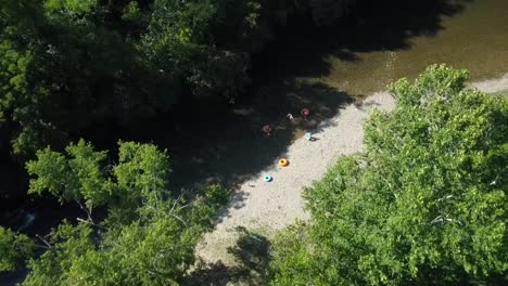 family tubing in the creek in the mountains