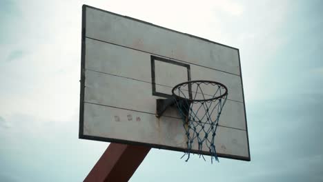 basketball shield with a ring standing on the street