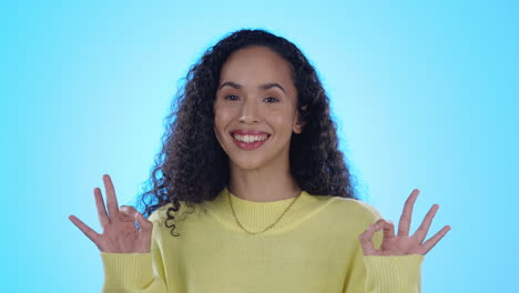 okay sign, excited and face of woman in studio