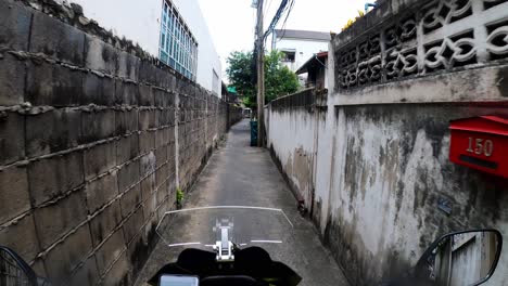 traveling along a narrow road of the streets in the city of bangkok