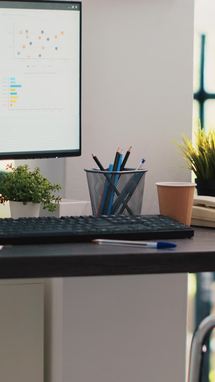 Vertical video Wheelchair in inclusive office and display showing marketing planning data