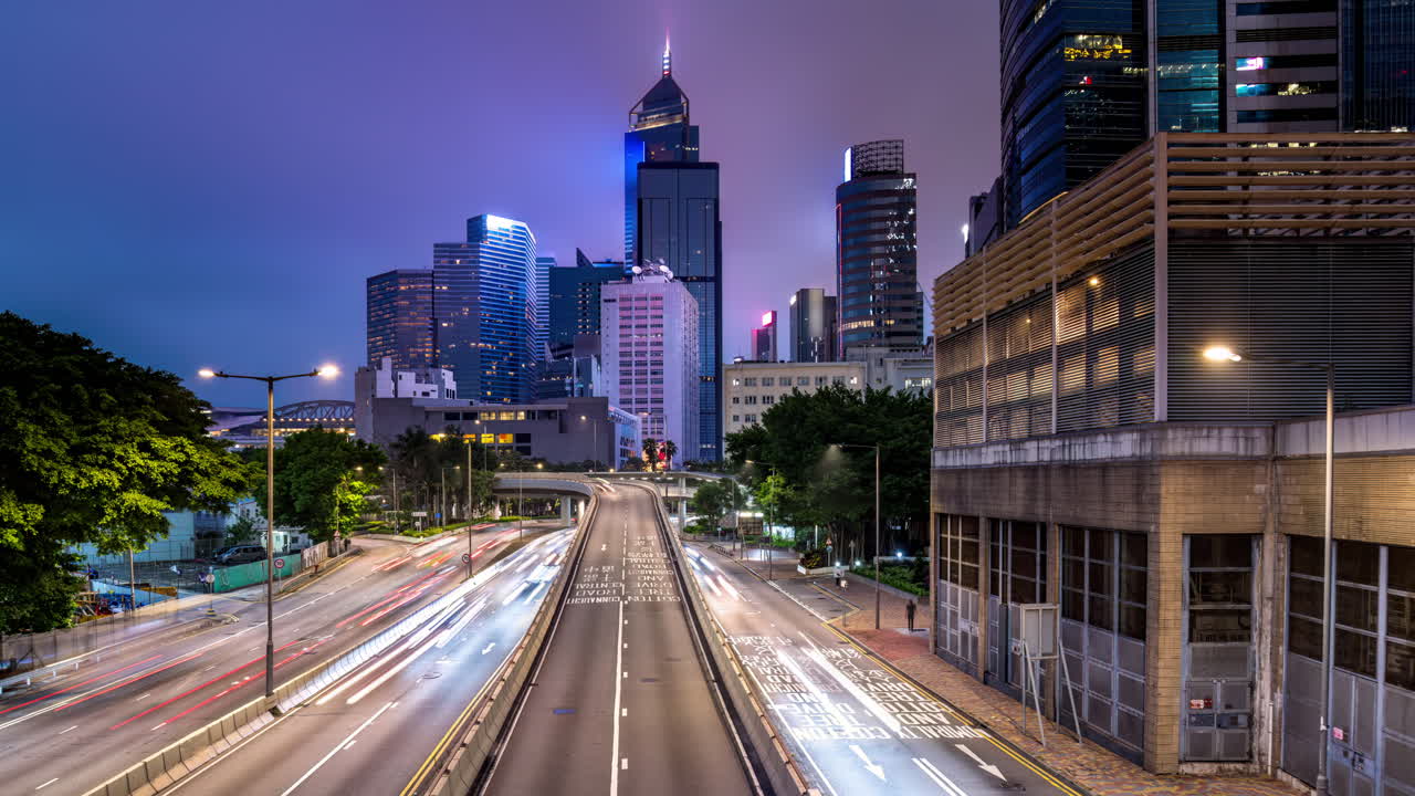 Night time lapse of heavy traffic on Victoria Park Road and Gloucester Road in Causeway Bay Hong Kong