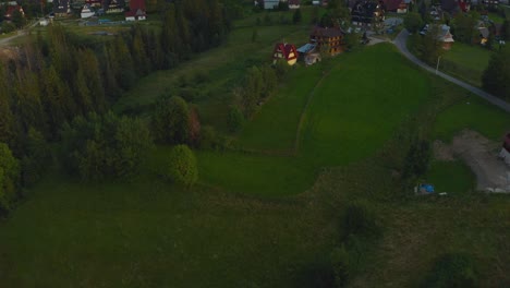 Beautiful-traditional-Polish-village-reveal-with-alpine-mountains-landscape-backdrop