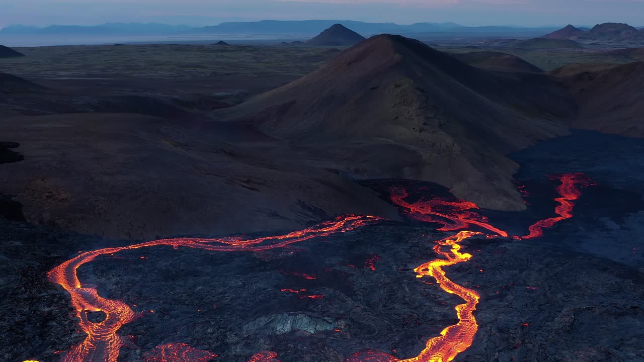 Lava Flow Over Icelandic Mountains at Sunrise/Sunset