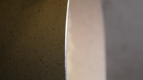 close-up of a speckled pan's edge