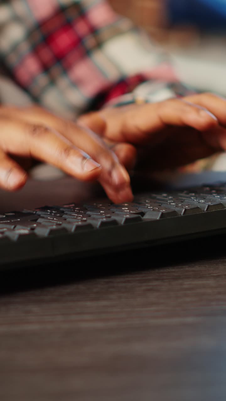 Hands typing on a computer keyboard