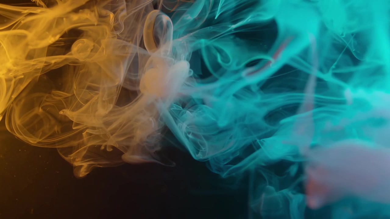 Dynamic Swirl of Yellow and Blue Ink in Water
