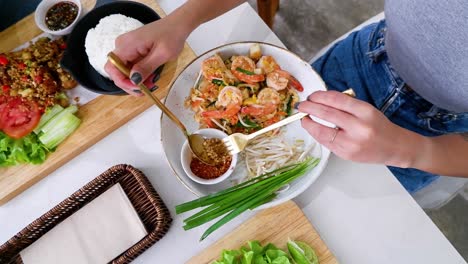 cooking and serving pad thai in ayutthaya, thailand