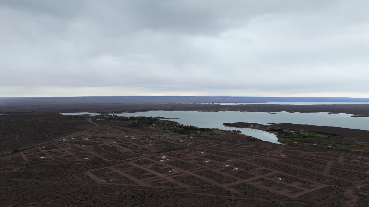 Wide pan shot of the water and landscape in argentina, islands on a cloudy day, slow motion and copy space