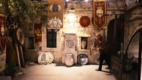 medieval fantasy scene: man in a stone courtyard