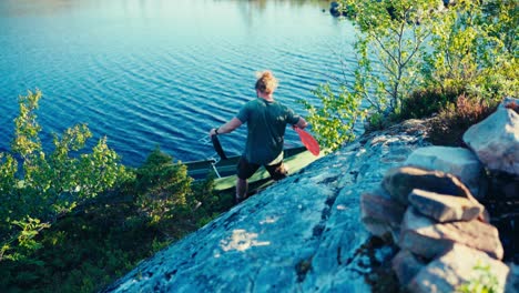 Man-Gets-Into-His-Boat-For-Fishing-In-Indre-Fosen,-Norway---Wide-Shot