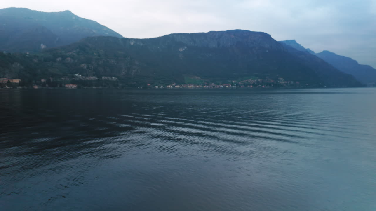 Waves on the Lake Como, Italy, tilting up to reveal the background