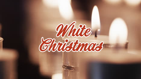 animation of white christmas text over lit candles background