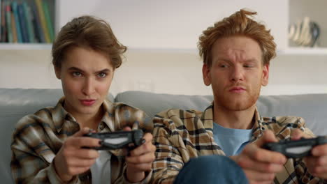 Gamers-holding-joystick-home-having-fun-closeup.-Players-enjoying-video-game.
