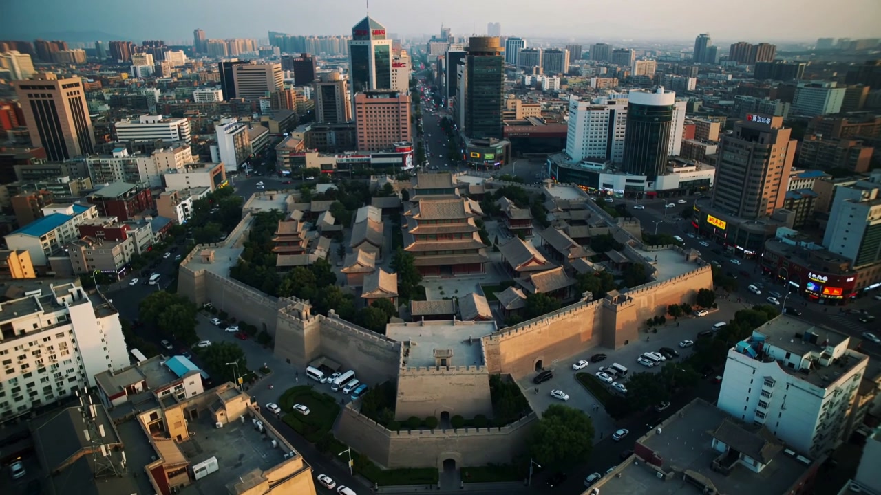 Descending drone capturing stone walls and central gate of fortress in downtown, revealing skyline