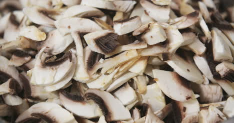 chef slicing mushrooms in kitchen 1