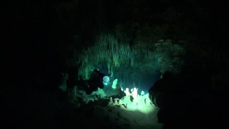 cave divers enter a decorated room