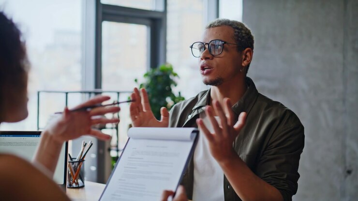 African american man discussing documents office meeting. Job interview talk.