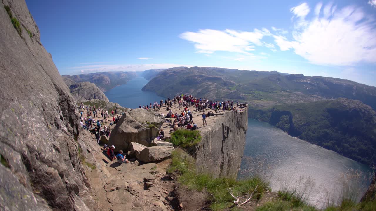 NORWAY- June 15, 2019: Preikestolen or Prekestolen, also known by the English translations of Preacher's Pulpit or Pulpit Rock, is a famous tourist attraction in Forsand, Ryfylke, Norway