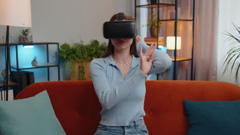 woman using virtual reality futuristic technology headset to play simulation 3d video game at home