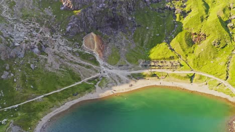 snowdonia national park - slow descending aerial over the emerald waters of lake llyn llydaw