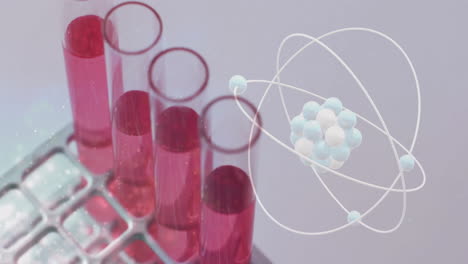 Animation-of-atom-over-laboratory-test-tubes-on-grey-background