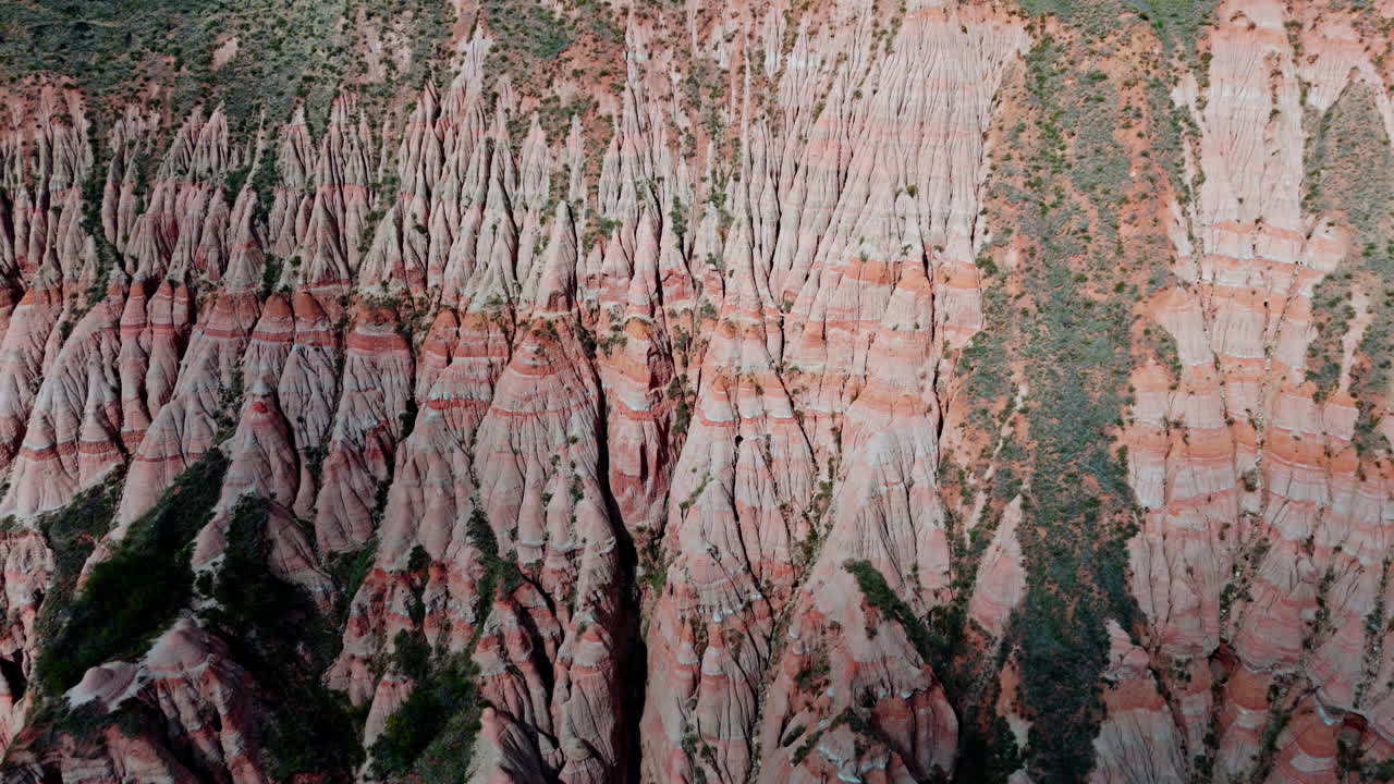 Majestic aerial view of Râpa Roșie's stunning red rock formations