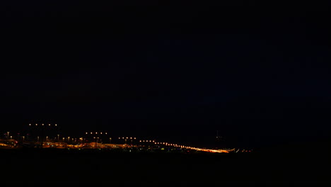 Plane-coming-into-land-at-Sydney-Airport-Sydney-NSW-Australia-at-night-shot-in-4k-high-resolution