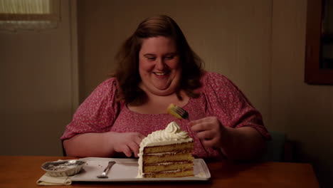 woman enjoying a large slice of cake