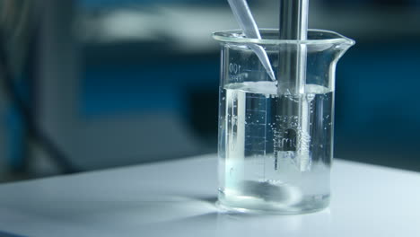laboratory experiment with beaker and stirrer