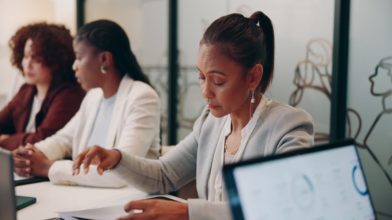 A group of businesswomen having a serious meeting in an office