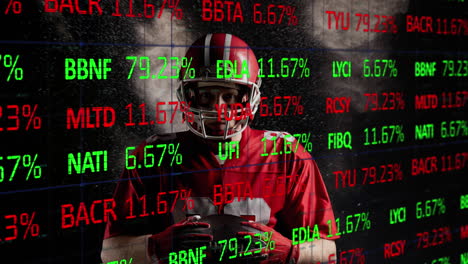 animación de datos del mercado de valores moviéndose sobre jugador de rugby afroamericano sosteniendo la pelota sobre el espacio