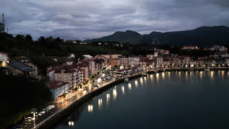 Sunset-Drone-Shot-of-Waterfront-in-Ribadesella,-Spain