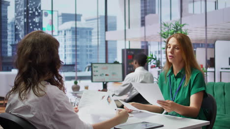 human resources staff evaluating candidates resume in the selection process