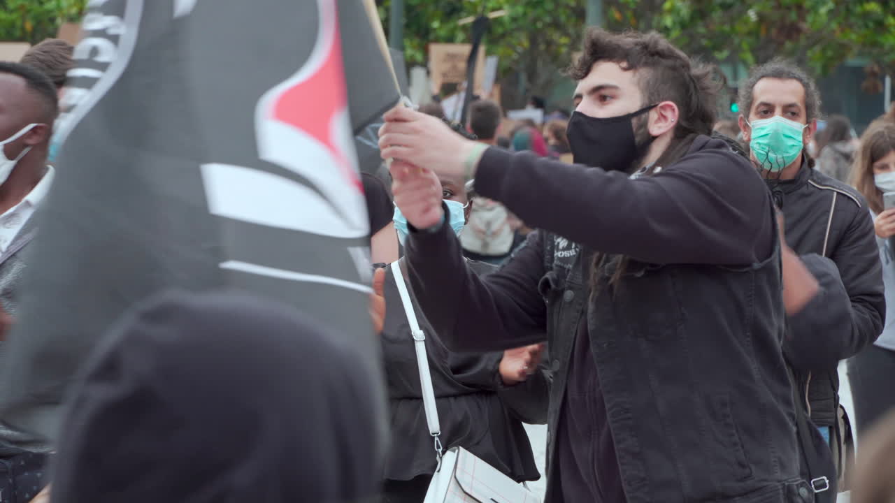 Porto  Portugal - june 6th 2020: BLM Black Lives Matter Protests Demonstration crowd protesting with masks