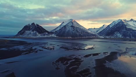 snowy mountains against sundown sky