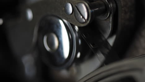 macro shot of film and gears in a vintage 8mm projector