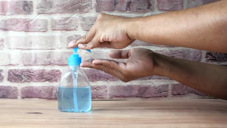 washing hands with hand sanitizer