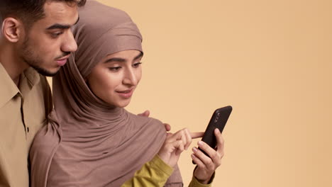 couple looking at a mobile phone