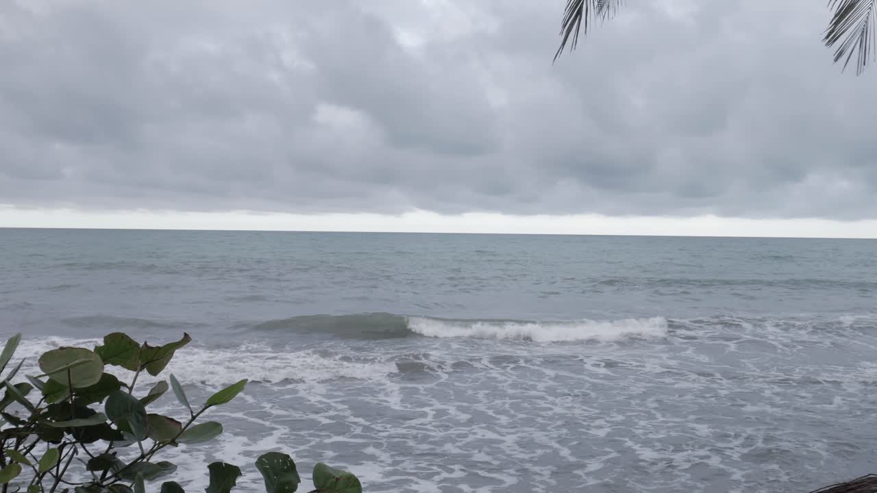 uhd shot of beach reveal between two chairs
