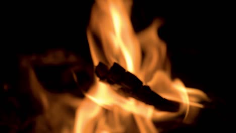 close up of the flames at a camp bonfire at night