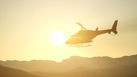 extreme slow motion flying helicopter and sunset sky